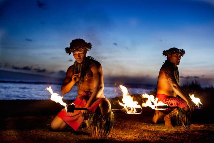 Two Hawaiian Men dancing with Fire at luau