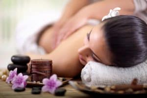 woman having back massage at spa