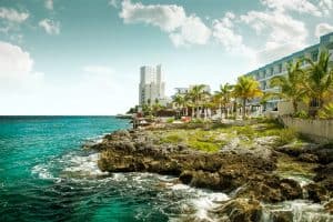 rugged coastline of cozumel with hotel in background