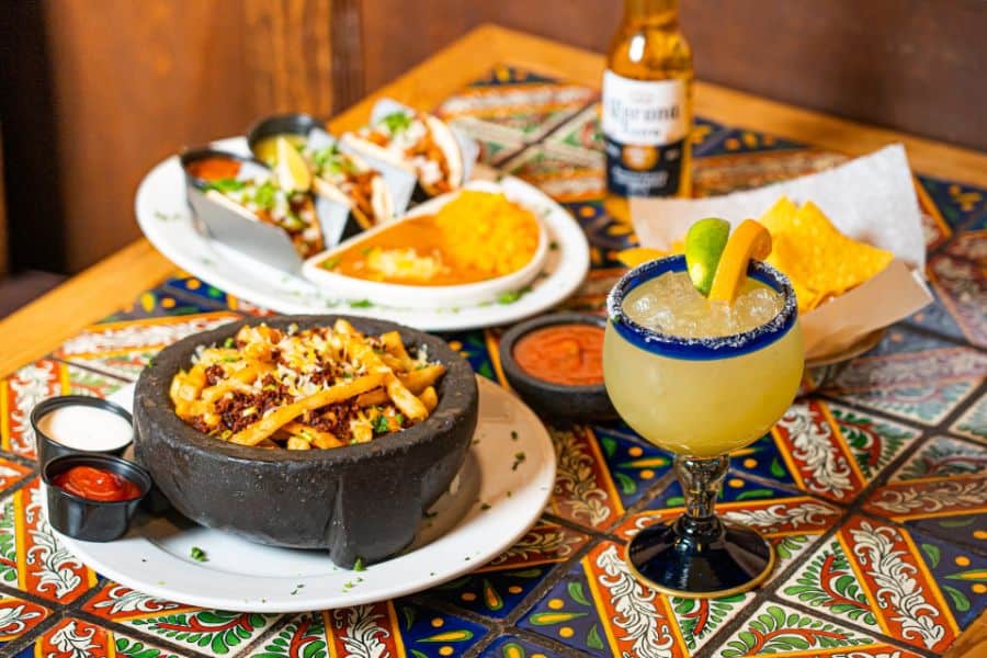 variety of mexican dishes and margarita sp