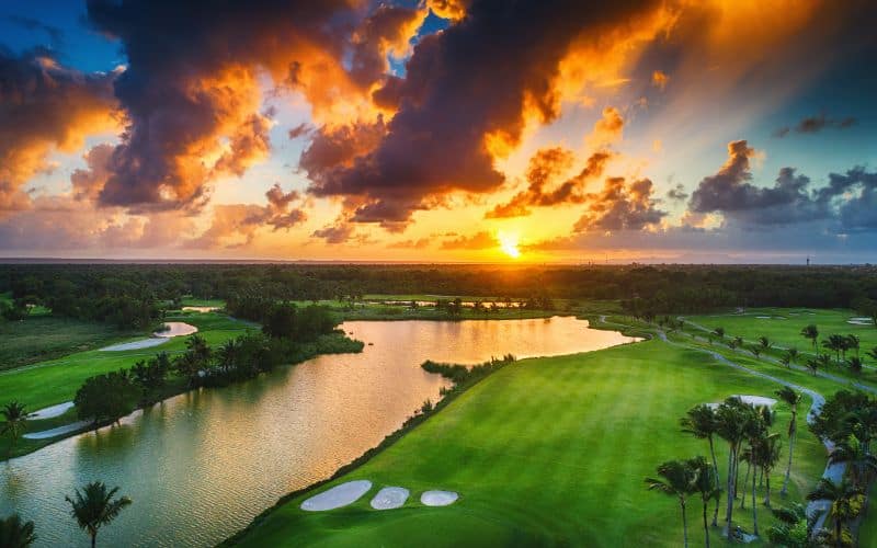 Aerial view of tropical golf course at sunset Dominican Republic