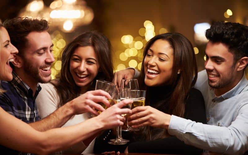 Group Of Friends Enjoying Drinks In Bar 1