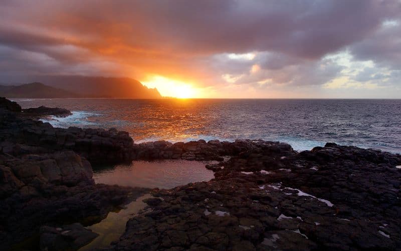 sunset at Queens Bath on island of Kauai