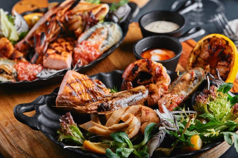 Assorted grilled seafood on plates