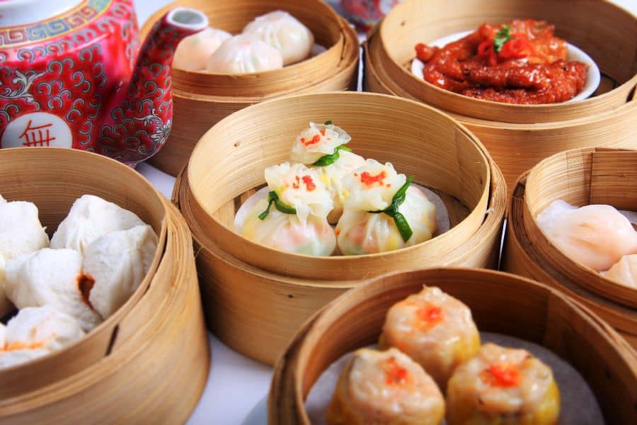 variety of dim sum dishes on a table