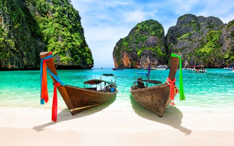 Beautiful beach with thai traditional wooden longtail boat and blue sky in Maya bay Thailand