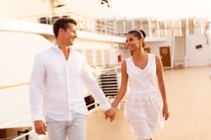 Couple holding hands on cruise ship
