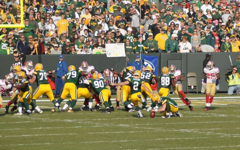 Mason Crosby of the Green Bay Packers attempts a field goal in a game at Lambeau Field against the San Francisco 49ers