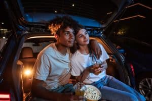couple watching a movie at a drive in theater