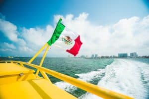 mexico flag on boat in cancun