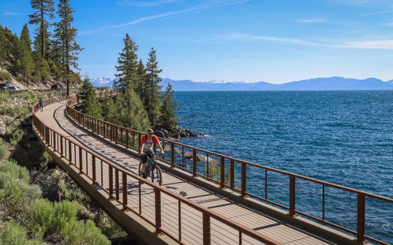 A bicyclist rides along Lake Tahoe's East Shore Trail in the summer