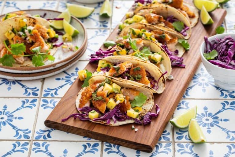 Fish tacos with mango salsa and purple cabbage