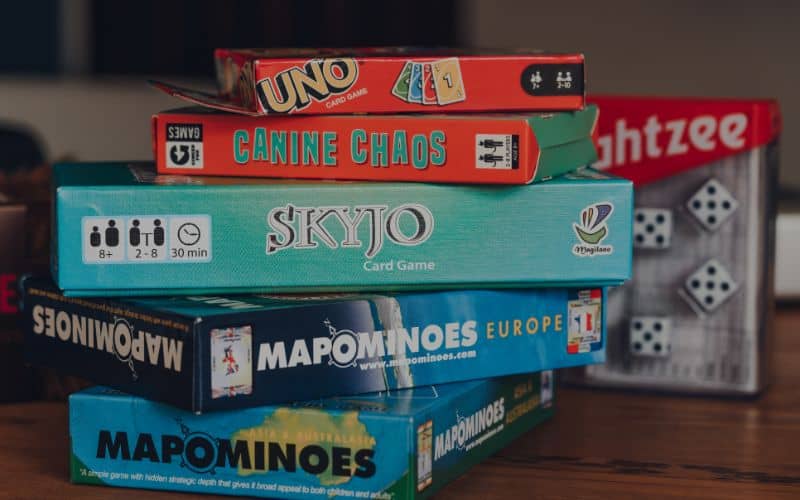 Stack of modern and classing board games on a table
