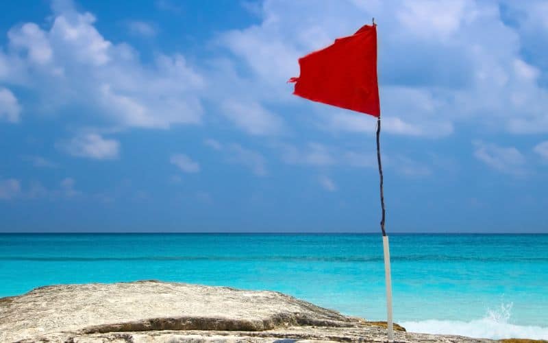 red flag on the beach Cancun Mexico