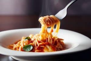 spaghetti with tomato sauce and parmesan cheese