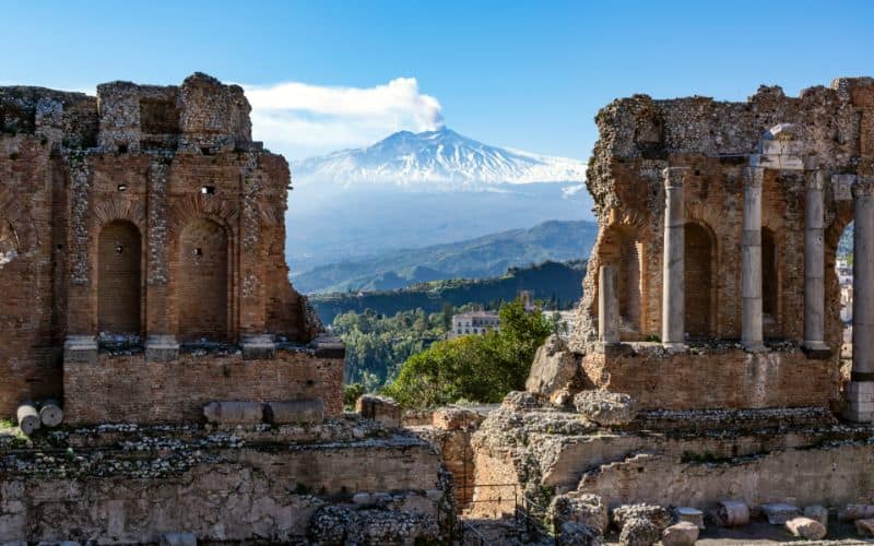 Ancient ruins with Volcano Etna in Sicily