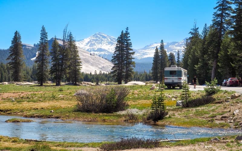 Camper caravan parked amidst Sierra Nevada mountain range in Yosemite National Park California USA