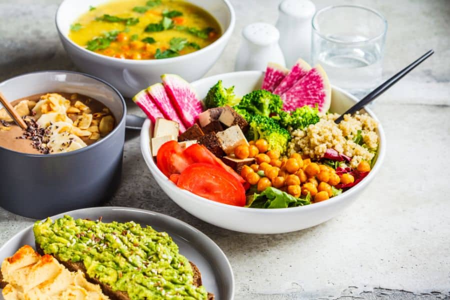 Chocolate smoothie bowl Buddha bowl with tofu chickpeas and quinoa lentil soup and toasts