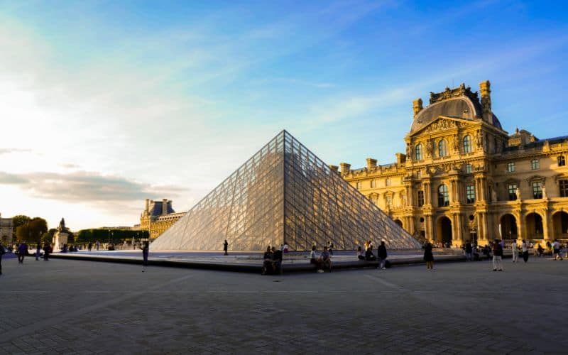 Louvre museum and the pyramid at sunset