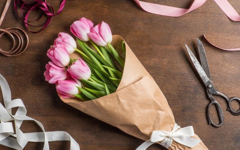 beautiful pink tulips bouquet in wrapping paper