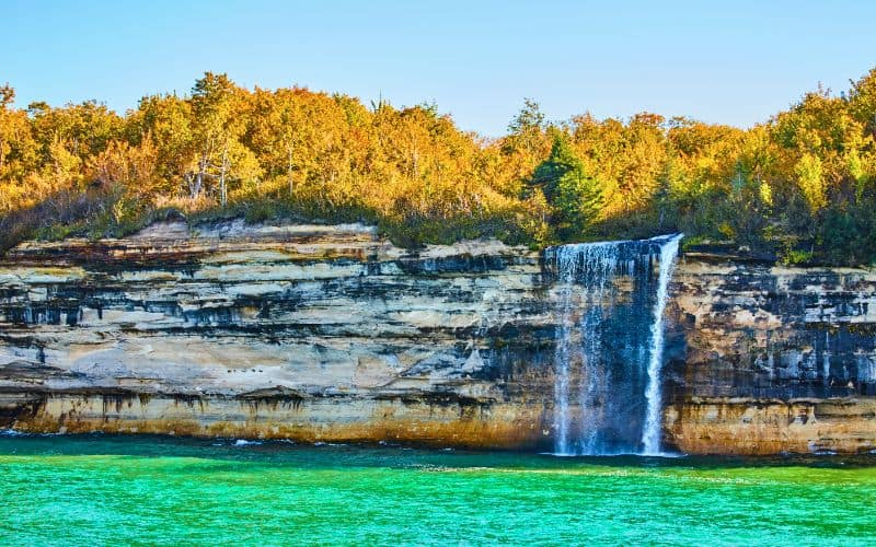 Waterfall cascading off Pictured Rocks