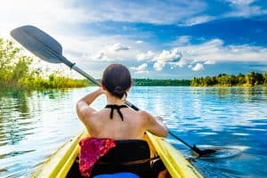 Woman with kayak on the Amazon river Brazil