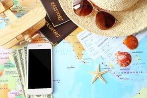 smartphone money passports and tickets on world map
