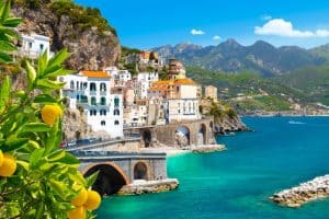 Beautiful view of Amalfi on the Mediterranean coast with lemons in the foreground Italy
