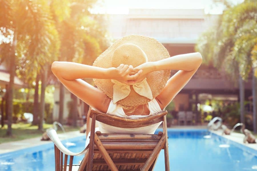 woman relaxing in tropical villa during summer