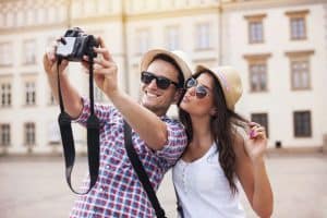 Happy tourists taking photo of themselves