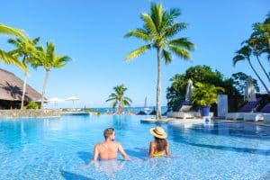 Man and Woman relaxing in a swimming pool