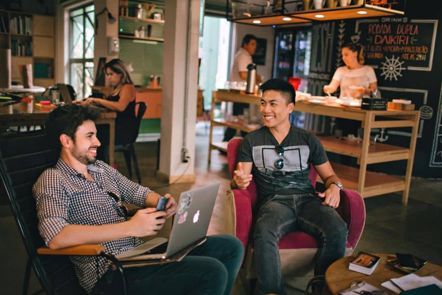 Men Having Conversation Seating on Chair sp