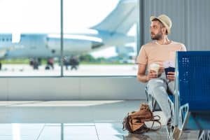 Traveler with passports and tickets waiting at the airport