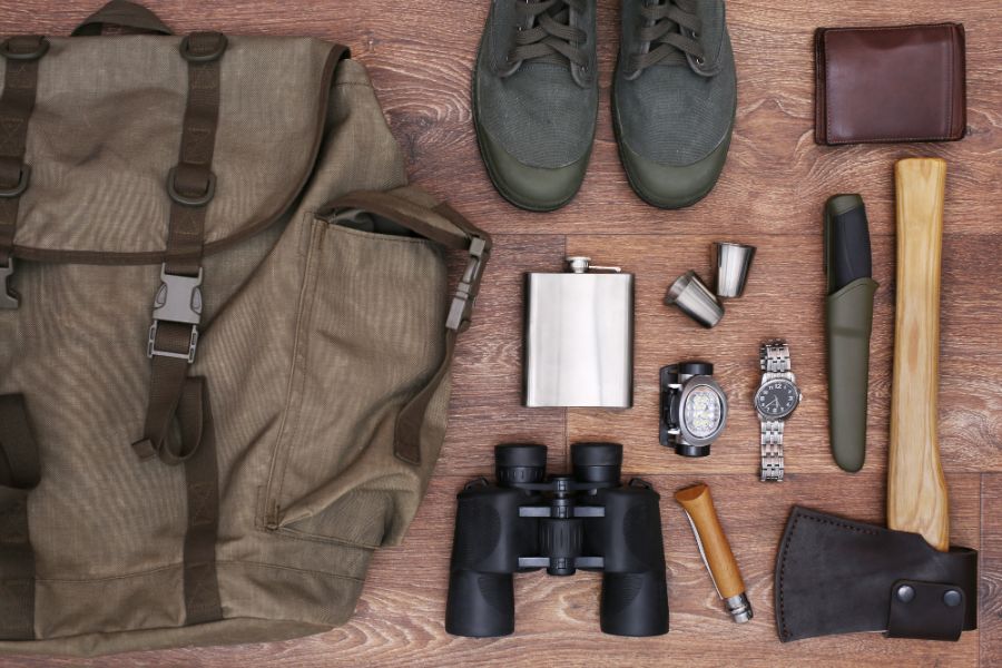 Travelling accessories on wooden background