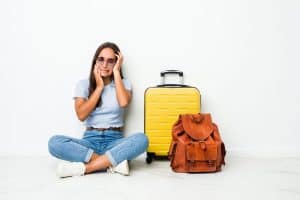 Young woman ready to go to travel whining and crying