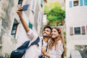 couple traveling and taking a selfie