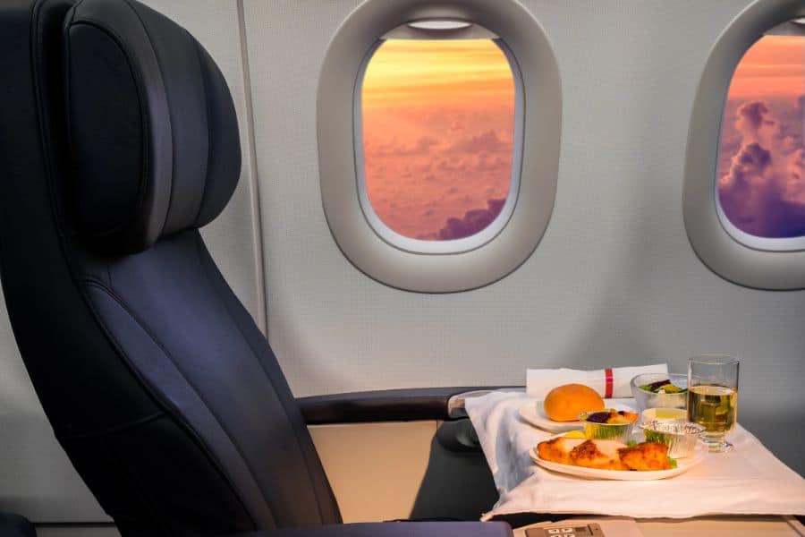 first class seat with Lunch on board of airplane