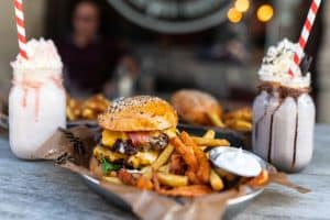 gourmet burger fries and two milkshakes sp