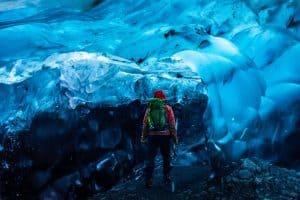 man exploring Ice Caves Vatnajokull Iceland