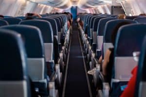 view of airplane seats from the middle aisle