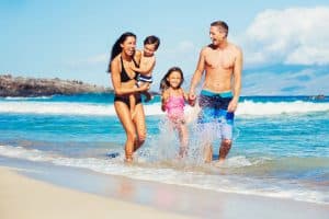 Happy Family Having Fun at the Beach