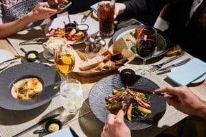 people eating delicious food in restaurant