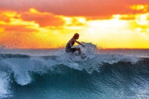 person surfing during sunset sp