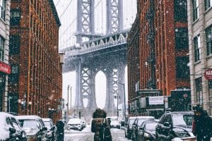 view of brooklyn bridge during winter snow new york