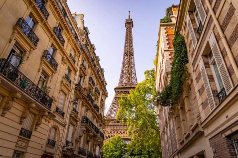 Beautiful view to the Eiffel Tower in Paris between residential houses