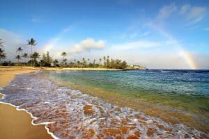 Rainbow above poipu beach in Kauai