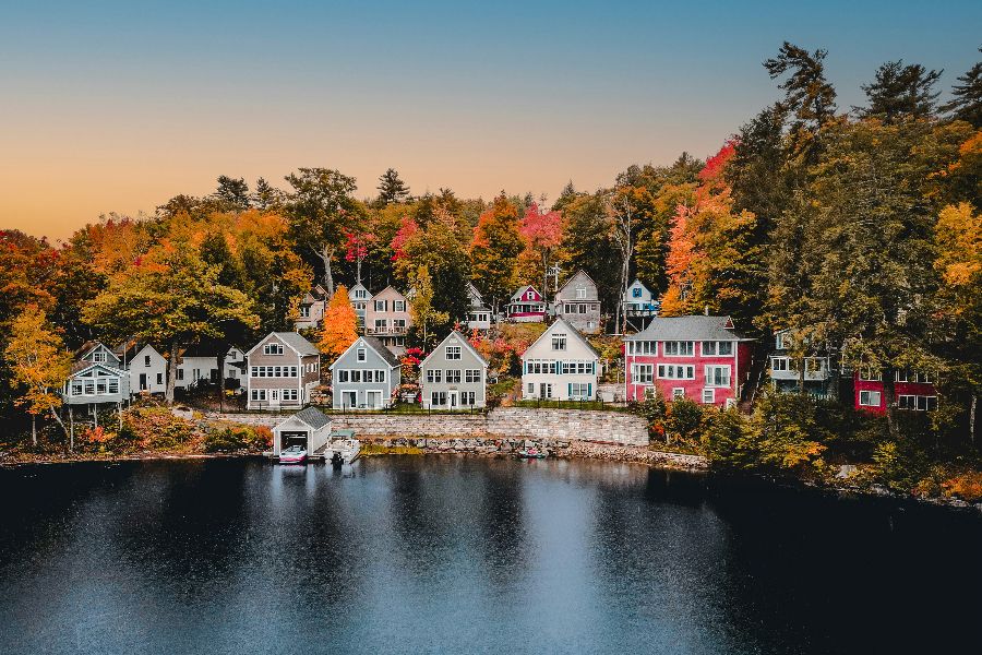 An aerial view of homes on Lake Winnepesauke New Hampshire during peak foliage season sp