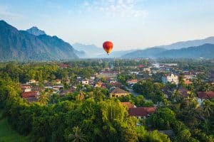 Hot air balloon over Nam Song river at sunrise in Vang vieng laos