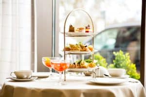 Beautiful english afternoon tea ceremony with desserts and snacks