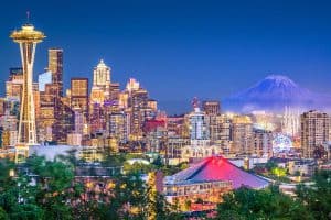 Seattle Washington USA downtown skyline at night with Mt Rainier